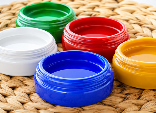 Colorful plastic bottle caps on a woven surface