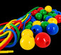 Colorful jump rope with multicolored plastic beads on a black background