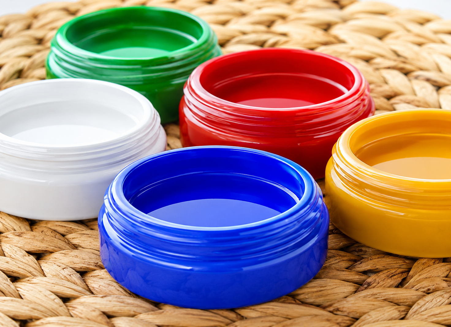 Colorful plastic bottle caps on a woven surface