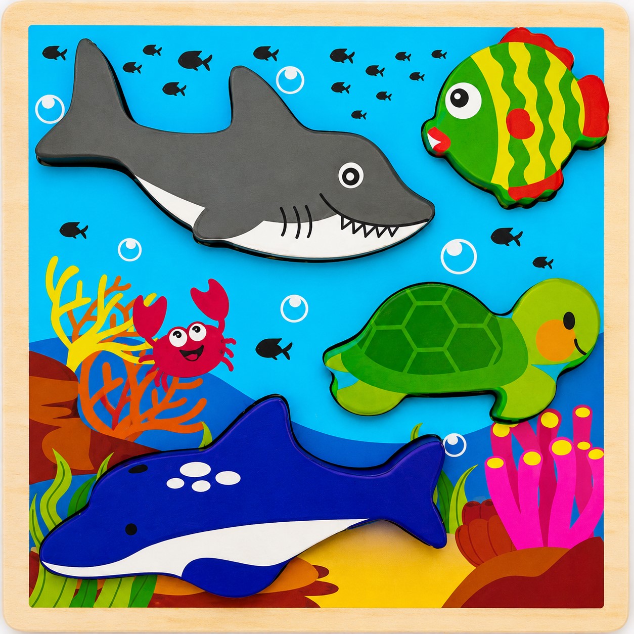 Children's puzzle with shark, turtle, and dolphin pieces on an underwater-themed background.