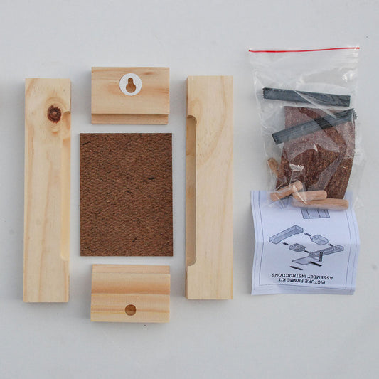 Wooden crafting materials including planks, a block with a hole, sandpaper, and blueprints on a white background